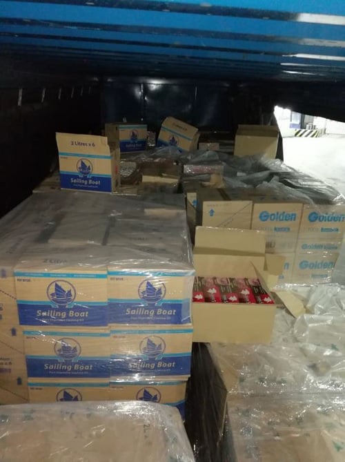 Duty-unpaid cigarettes found amongst the consignment of cooking oil (Source : ICA).