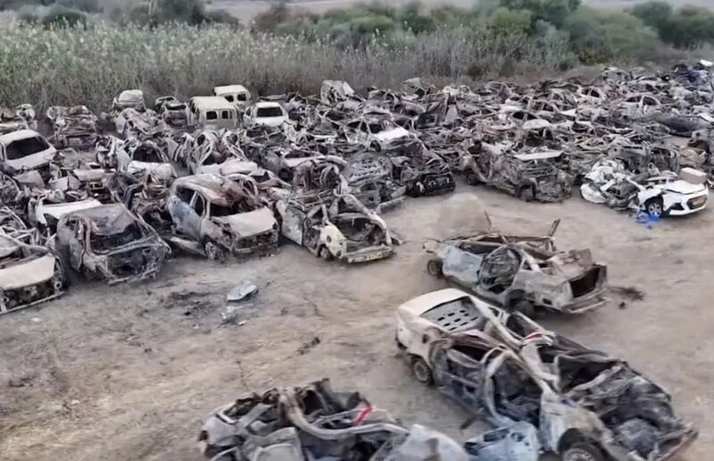 Drone footage released by the Israeli military last month reveals the extensive destruction of vehicles fleeing the Supernova rave on 7 October, damage likely caused by Israeli drones and helicopters. (RT/Israeli military)